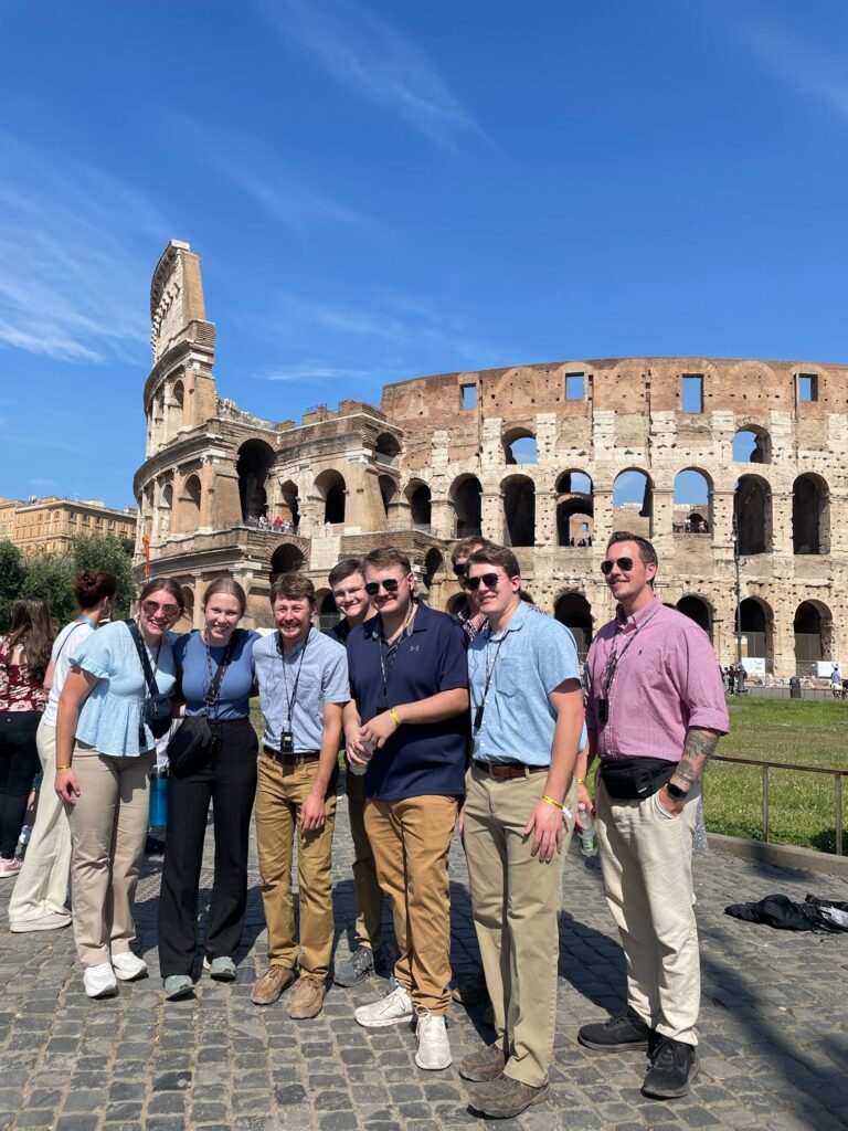 Emma Davidson, far left, and the CALS study abroad group at the Colosseum in Rome, Italy.